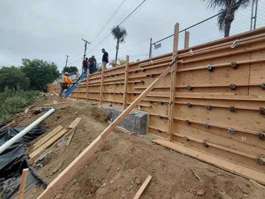 Retaining wall install in LA Mirada - The hill side fell down and the rest was compromised. We installed this 130ft retaining wall to save the hillside and future damage to the house. Retaining wall install in LA Mirada - The hill side fell down and the rest was compromised. We installed this 130ft retaining wall to save the hillside and future damage to the house.