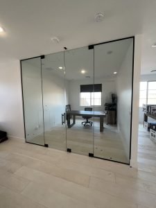 Glass Partition Walls - Frameless Glass Company designs and installs custom glass partition walls for homes and offices across the greater Austin area. Instead of framing in a solid wall that shrinks a room, a glass partition divides the space while keeping light moving and the layout feeling open. It's an ideal solution for home offices, conference rooms, closets, and anywhere you want separation without losing the airy feel.
Every partition is built to the space. Configurations range from half-height dividers and panels set on pony walls to full floor-to-ceiling walls, vertical sidelights beside doors, and designs with a horizontal top beam. Glass options run from ultra-clear panels that maximize light in smaller rooms to frosted and tinted glass when privacy matters. Frosted glass is a popular choice for home offices, where a partition cuts noise and clutter without boxing the room in.
The process is handled start to finish by their in-house team: consultation and precise field measurements, custom design, a virtual agreement to kick things off, then professional installation scheduled around your calendar. Turnaround times are among the fastest in the market, and every install is backed by their limited lifetime craftsmanship warranty.
Serving Austin and surrounding Travis, Hays, and Williamson County communities. Quotes take five minutes or less. Glass Partition Walls - Frameless Glass Company designs and installs custom glass partition walls for homes and offices across the greater Austin area. Instead of framing in a solid wall that shrinks a room, a glass partition divides the space while keeping light moving and the layout feeling open. It's an ideal solution for home offices, conference rooms, closets, and anywhere you want separation without losing the airy feel.
Every partition is built to the space. Configurations range from half-height dividers and panels set on pony walls to full floor-to-ceiling walls, vertical sidelights beside doors, and designs with a horizontal top beam. Glass options run from ultra-clear panels that maximize light in smaller rooms to frosted and tinted glass when privacy matters. Frosted glass is a popular choice for home offices, where a partition cuts noise and clutter without boxing the room in.
The process is handled start to finish by their in-house team: consultation and precise field measurements, custom design, a virtual agreement to kick things off, then professional installation scheduled around your calendar. Turnaround times are among the fastest in the market, and every install is backed by their limited lifetime craftsmanship warranty.
Serving Austin and surrounding Travis, Hays, and Williamson County communities. Quotes take five minutes or less.