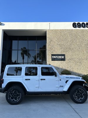 Jeep / Wrangler - With its robust and adventurous spirit, the Jeep Wrangler isn’t just a vehicle; it’s a symbol of boundless freedom and exploration. Tint Crew proudly offers a window tinting service that not only enhances the Wrangler’s rugged aesthetics but also arms it with an extra layer of protection against the elements.
Precision Tinting for the Iconic Wrangler
Navigating through each unique and bold contour of the Jeep Wrangler, our specialists deploy a careful and precise tinting approach. We ensure that every window, from the side panels to the rear, is immaculately tinted, aligning with the Wrangler’s fearless disposition and design.
Why Choose Tint Crew for Your Wrangler?
Flawless Application: Each Wrangler is treated with meticulous care and attention to detail, guaranteeing a flawless tint application that stands the test of time and adventures.
Durability and Protection: Utilizing only premium-quality tinting films, we shield your Wrangler from harmful UV rays, providing added durability and a safeguard for your adventures ahead.
Adventure in Comfort: Our tints do more than just enhance privacy; they ensure a cooler and more comfortable cabin, reducing glare and heat even in the most challenging terrains.
Unmatched Experience: Tint Crew brings to the table a wealth of experience, particularly with robust vehicles like the Wrangler, ensuring your ride is in expert hands.
Embark on Adventures with Enhanced Style and Security
Your Jeep Wrangler isn’t simply a mode of transport; it’s a companion in every escapade. Tint Crew is dedicated to ensuring that your Wrangler is not only shielded from the sun’s glare but also boasts a sleek, polished look to make a statement wherever the trails take you.
Venture into your next journey with confidence and style. Connect with Tint Crew today, ensuring your Jeep Wrangler is ready to face every adventure head-on. Jeep / Wrangler - With its robust and adventurous spirit, the Jeep Wrangler isn’t just a vehicle; it’s a symbol of boundless freedom and exploration. Tint Crew proudly offers a window tinting service that not only enhances the Wrangler’s rugged aesthetics but also arms it with an extra layer of protection against the elements.
Precision Tinting for the Iconic Wrangler
Navigating through each unique and bold contour of the Jeep Wrangler, our specialists deploy a careful and precise tinting approach. We ensure that every window, from the side panels to the rear, is immaculately tinted, aligning with the Wrangler’s fearless disposition and design.
Why Choose Tint Crew for Your Wrangler?
Flawless Application: Each Wrangler is treated with meticulous care and attention to detail, guaranteeing a flawless tint application that stands the test of time and adventures.
Durability and Protection: Utilizing only premium-quality tinting films, we shield your Wrangler from harmful UV rays, providing added durability and a safeguard for your adventures ahead.
Adventure in Comfort: Our tints do more than just enhance privacy; they ensure a cooler and more comfortable cabin, reducing glare and heat even in the most challenging terrains.
Unmatched Experience: Tint Crew brings to the table a wealth of experience, particularly with robust vehicles like the Wrangler, ensuring your ride is in expert hands.
Embark on Adventures with Enhanced Style and Security
Your Jeep Wrangler isn’t simply a mode of transport; it’s a companion in every escapade. Tint Crew is dedicated to ensuring that your Wrangler is not only shielded from the sun’s glare but also boasts a sleek, polished look to make a statement wherever the trails take you.
Venture into your next journey with confidence and style. Connect with Tint Crew today, ensuring your Jeep Wrangler is ready to face every adventure head-on.