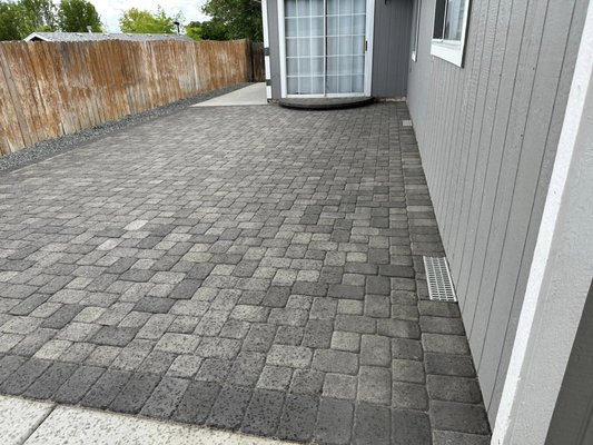 Concrete & Paver Installation - Client had his entire backyard flooded, worse it caused serious damage to his basement. He decided to go with a zeroscape that included Concrete and Pavers. More importantly, proper grading and drainage system. 
2% grade away from house
Concrete 
Pavers 
French Drain
Nevada Blue Rock