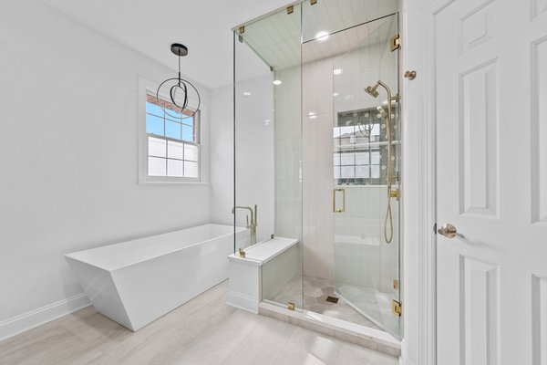 Custom Master Bathroom Project - Custom master bathroom remodeling. Large walk-in shower, free-standing bathtub, double vanity, porcelain tile and painting. Custom Master Bathroom Project - Custom master bathroom remodeling. Large walk-in shower, free-standing bathtub, double vanity, porcelain tile and painting.