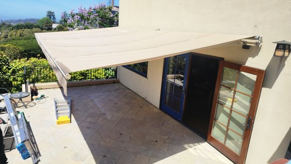 Awning re-cover - This awning had seen the better part of 20 years of use. Sun and wind had taken it's toll so we set out to re-cover it. The existing frame and motor were in good shape so the client was able to select new fabric and we were in business. Awning re-cover - This awning had seen the better part of 20 years of use. Sun and wind had taken it's toll so we set out to re-cover it. The existing frame and motor were in good shape so the client was able to select new fabric and we were in business.