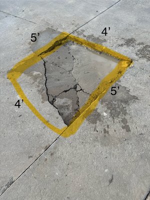Concrete Patches - These potholes were cut out and patched for vehicle traffic Concrete Patches - These potholes were cut out and patched for vehicle traffic