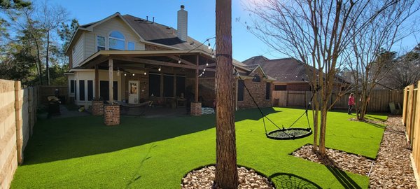 Natalia & JP Backyard Makeover - Project Description: Backyard Transformation and Drainage Solution Referred by Home Depot Pro, Natalia & JP sought a solution for their persistent drainage issues and envisioned a backyard oasis where they could play with their daughter year-round. We began by addressing the drainage problem with a custom storm drainage system, followed by precise leveling and grading to ensure proper water flow and prevent future issues. We installed gravel around the tree and utility lines to enhance the space for functionality and aesthetics. Finally, we transformed the yard by installing over 4,000 square feet of premium artificial grass, creating a vibrant, low-maintenance lawn. The result exceeded their expectations, turning their previously unusable, muddy backyard into a luxurious and functional space they can now enjoy daily. Natalia & JP were thrilled with the transformation, sharing that they had never been able to use their backyard until now.