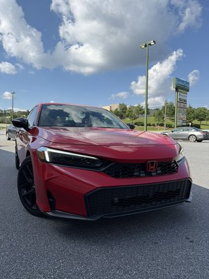 Ceramic Window Tint Install - Honda Civic came in with a sport spoiler requesting a professional install by our team! Added style and protection with ceramic window tint, red paint matched calipers, and even custom painted emblems!