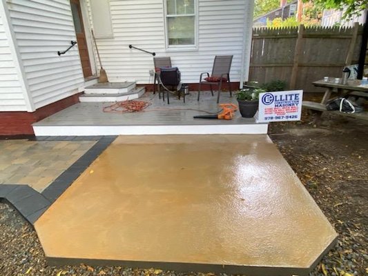 Backyard deck and patio - This customer wanted a larger deck but because of this city's setbacks there wasn't enough room so a combination patio and deck was designed. An access door to the basement steps was designed as a trap door so there as full use of the deck for a table and chairs. A hot tub pad was sized for the hot tub (on order) which again had to fit into the setback area. As you can see, it all worked out beautifully. Backyard deck and patio - This customer wanted a larger deck but because of this city's setbacks there wasn't enough room so a combination patio and deck was designed. An access door to the basement steps was designed as a trap door so there as full use of the deck for a table and chairs. A hot tub pad was sized for the hot tub (on order) which again had to fit into the setback area. As you can see, it all worked out beautifully.