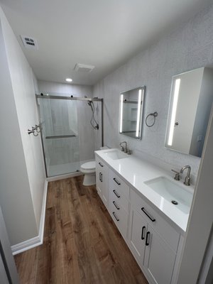 Bathroom Remodel - We took out a wall, installed a new wall and door to close off the bathroom, redid the shower, installed new lighting, vanity, flooring, lighted cabinet mirrors, toilet, exhaust fan, etc. Bathroom Remodel - We took out a wall, installed a new wall and door to close off the bathroom, redid the shower, installed new lighting, vanity, flooring, lighted cabinet mirrors, toilet, exhaust fan, etc.
