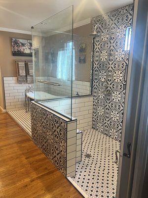 Tamara’s bathroom remodel - This job was done in historic part of Phoenix. The house Was built in the 30s. Some of the challenges we face was a a frame wood flooring no concrete. The floor needed to be repaired. We took this opportunity to install new waterlines and drain lines while the floor was being repaired. So older homes can cause more of a challenge with all the modern equipment parts makes it easier and affordable in today’s market. The cool features about this bathroom is having the shower valves on the outside of the tile wall instead of behind the tile. The built-in bench, not too tall to use it as a leg rest. Another cool feature about the shower. Is the built in soap niche and how we transition Tile to wood floors. In the freestanding tub area you notice we also how cool features like a niche for the soap easy to get to shower valve with tub filler and also the smooth surface from tile to wood floors. I like the shower and tub areas because it has a lot of patterns on the walls and it was very hard to match up walls when you have different tile around surrounding walls.
We installed the shower glass too. Tamara’s bathroom remodel - This job was done in historic part of Phoenix. The house Was built in the 30s. Some of the challenges we face was a a frame wood flooring no concrete. The floor needed to be repaired. We took this opportunity to install new waterlines and drain lines while the floor was being repaired. So older homes can cause more of a challenge with all the modern equipment parts makes it easier and affordable in today’s market. The cool features about this bathroom is having the shower valves on the outside of the tile wall instead of behind the tile. The built-in bench, not too tall to use it as a leg rest. Another cool feature about the shower. Is the built in soap niche and how we transition Tile to wood floors. In the freestanding tub area you notice we also how cool features like a niche for the soap easy to get to shower valve with tub filler and also the smooth surface from tile to wood floors. I like the shower and tub areas because it has a lot of patterns on the walls and it was very hard to match up walls when you have different tile around surrounding walls.
We installed the shower glass too.