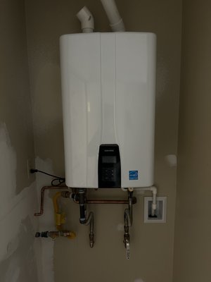 Tankless water water upgrade. - This customer wanted to upgrade his water heater from a tank water heater to a tankless. We removed the old water heater, move the water lines and gas line inside the wall and Installed a drain for the condensation. Customer was very happy with his upgrade! Tankless water water upgrade. - This customer wanted to upgrade his water heater from a tank water heater to a tankless. We removed the old water heater, move the water lines and gas line inside the wall and Installed a drain for the condensation. Customer was very happy with his upgrade!