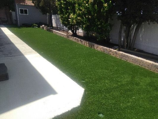 Artificial turf installation - In the before picture it shows the preparation for the installation of the synthetic grass as well as a drainage system. In the edge, we were building a concrete planter that the owner had requested. Artificial turf installation - In the before picture it shows the preparation for the installation of the synthetic grass as well as a drainage system. In the edge, we were building a concrete planter that the owner had requested.