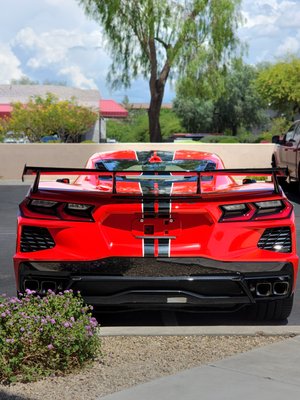 Corvette C8 Paint Correction and Ceramic Coating - This Corvette C8 came to us with the owner wanting the vehicle to enhance his new vehicle with a ceramic coating on the entire vehicle. We found the best fit to be our Supreme Ceramic Coating package. Despite the vehicle being only a few months old the Corvette needed some work to get the paint looking better then new. Our first step is to wash the vehicle using a degreasing agent to remove any wax, tar, and road-grime that has been accumulated. Once the vehicle looked clean it was time to make the paint feel smooth by removing any impurities in the paint. After the vehicle feels smooth, the swirl marks from shipping and driving are removed. A surface prep cleaner is used to remove any residual compound from the previous step. Our ceramic coating is applied and leveled before the excess is removed. Once the coating is cured (12hours) it can be taken outside to ensure there is no haziness or high-spots left on the paint. The paint, glass, headlights, and wheels are coated to protect them from the elements and allow for easy cleaning due to the ceramics hydrophobic properties. Corvette C8 Paint Correction and Ceramic Coating - This Corvette C8 came to us with the owner wanting the vehicle to enhance his new vehicle with a ceramic coating on the entire vehicle. We found the best fit to be our Supreme Ceramic Coating package. Despite the vehicle being only a few months old the Corvette needed some work to get the paint looking better then new. Our first step is to wash the vehicle using a degreasing agent to remove any wax, tar, and road-grime that has been accumulated. Once the vehicle looked clean it was time to make the paint feel smooth by removing any impurities in the paint. After the vehicle feels smooth, the swirl marks from shipping and driving are removed. A surface prep cleaner is used to remove any residual compound from the previous step. Our ceramic coating is applied and leveled before the excess is removed. Once the coating is cured (12hours) it can be taken outside to ensure there is no haziness or high-spots left on the paint. The paint, glass, headlights, and wheels are coated to protect them from the elements and allow for easy cleaning due to the ceramics hydrophobic properties.