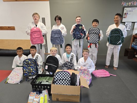 Backpack Drive for Community - At Master Shin’s Taekwondo, we believe that true mastery of Taekwondo is not found in the strength of one's kick, but in the strength of one’s contribution to the Life Union. Our annual Backpack Drive is a cornerstone of our character development program, designed to bridge the gap between individual growth and community well-being.
Our Mission in Action:
Highest Training: We teach our students that discipline extends beyond the mat. Preparing these backpacks requires focus, organization, and a heart of service.
Empowering the Best Person: By participating, students move beyond the ego and find their 'Original Self'—the part of us that finds joy in lifting others.
Better Community: We are proud to be an active part of the Puyallup community. A stronger community begins with supported and confident children.
Through this project, our students exercise their 'Mind Muscle', learning that leadership is defined by how much we give back to the world around us. We don’t just train martial artists; we nurture compassionate leaders who understand that we are all interconnected. Backpack Drive for Community - At Master Shin’s Taekwondo, we believe that true mastery of Taekwondo is not found in the strength of one's kick, but in the strength of one’s contribution to the Life Union. Our annual Backpack Drive is a cornerstone of our character development program, designed to bridge the gap between individual growth and community well-being.
Our Mission in Action:
Highest Training: We teach our students that discipline extends beyond the mat. Preparing these backpacks requires focus, organization, and a heart of service.
Empowering the Best Person: By participating, students move beyond the ego and find their 'Original Self'—the part of us that finds joy in lifting others.
Better Community: We are proud to be an active part of the Puyallup community. A stronger community begins with supported and confident children.
Through this project, our students exercise their 'Mind Muscle', learning that leadership is defined by how much we give back to the world around us. We don’t just train martial artists; we nurture compassionate leaders who understand that we are all interconnected.