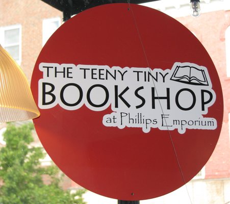 The Teeny Tiny Bookshop - The Teeny Tiny Bookshop found its way into Phillips Emporium in September 2017. It really is tiny but has a breadth of interests: classics, poetry, fiction; mystery, crime, & detective stories; politics, science, science fiction, fantasy, social and political issues; history and historic fiction; finance; nutrition & cooking; and special categories including travel guides; card tricks, card games, & magic.
Our broad selection of books for children includes board books, classic tales, current favorites, and a nice collection of poetry and hardbound special editions that will stand the test of time.
The young adult section includes social issues, history, mystery, adventure, sci-fi, fantasy, & graphic novels.
Special orders are welcome! Other services include book mailing, and free gift wrapping . And for every book sold The Teeny Tiny Bookshop contributes to the Benton Middle School Library. Try sending your order using the "Contact Info" form The Teeny Tiny Bookshop - The Teeny Tiny Bookshop found its way into Phillips Emporium in September 2017. It really is tiny but has a breadth of interests: classics, poetry, fiction; mystery, crime, & detective stories; politics, science, science fiction, fantasy, social and political issues; history and historic fiction; finance; nutrition & cooking; and special categories including travel guides; card tricks, card games, & magic.
Our broad selection of books for children includes board books, classic tales, current favorites, and a nice collection of poetry and hardbound special editions that will stand the test of time.
The young adult section includes social issues, history, mystery, adventure, sci-fi, fantasy, & graphic novels.
Special orders are welcome! Other services include book mailing, and free gift wrapping . And for every book sold The Teeny Tiny Bookshop contributes to the Benton Middle School Library. Try sending your order using the "Contact Info" form