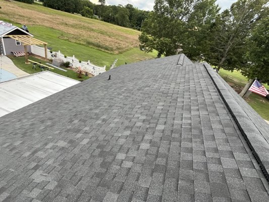 Full Roof Replacement with Black Shadow Shingles - After evaluating the roof's condition, we determined a full replacement was necessary. We removed the old roofing materials and expertly installed Atlas Pinnacle Architectural shingles in Black Shadow, ensuring they were covered by insurance. To enhance durability, we added a new underlayment, Ice and Water shield.