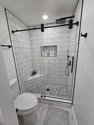 Bathroom remodel in Stanton - This remodel was done because the shower was leaking. The previous contractors didn't do the waterproofing and prep work correctly. We removed the old tub, framed in a new shower pan and bench seat. Installed new shower valves and tile. Installed new vanity, fixtures, and a paint job. Bathroom remodel in Stanton - This remodel was done because the shower was leaking. The previous contractors didn't do the waterproofing and prep work correctly. We removed the old tub, framed in a new shower pan and bench seat. Installed new shower valves and tile. Installed new vanity, fixtures, and a paint job.