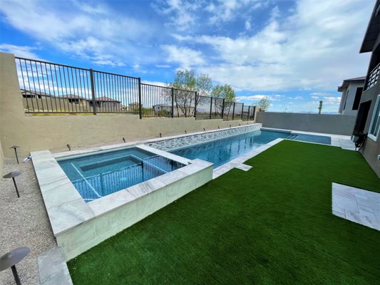 The Andrea Signature Pool Design w/spa - The Andrea Signature Pool Design with added spa. This model has beautiful combination of glass tile, ledger stone, tumbled marble pavers and a glass pebble finish. The Andrea Signature Pool Design w/spa - The Andrea Signature Pool Design with added spa. This model has beautiful combination of glass tile, ledger stone, tumbled marble pavers and a glass pebble finish.