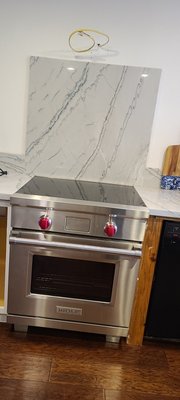 Installation new range hood and the venting pipe on wall, never had one. - Installation of Range Hood.