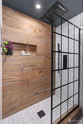 Kitchen Remodel 2024 - This remodel has modern fixtures, a sleek floating vanity, and elegant tile work to create a space that balances function and aesthetics. The homeowner also added ambient lighting a fresh color palette and luxurious touches.