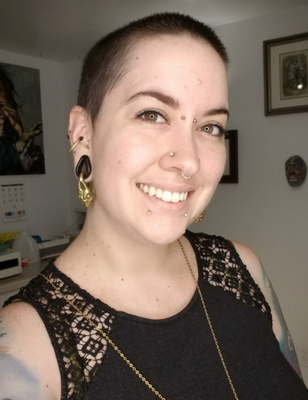 Body Piercer : Shandi - Shandi was trained by Diablo Rojo and became a body piercer in 2018 after a two-year apprenticeship. She is a proud member of the Association of Professional Piercers and is available for piercings at our Guadalupe location. Shandi is an Ear Specialist: from your first ever piercing, to a multitude of ear cartilage piercings and even full ear curation or custom jewelry design, she is here to help! She boasts an Applied Jewelry Professionals Degree from the Gemological Institute of America and has a passion for fine body jewelry. Shandi is also available for various other body piercings. Body Piercer : Shandi - Shandi was trained by Diablo Rojo and became a body piercer in 2018 after a two-year apprenticeship. She is a proud member of the Association of Professional Piercers and is available for piercings at our Guadalupe location. Shandi is an Ear Specialist: from your first ever piercing, to a multitude of ear cartilage piercings and even full ear curation or custom jewelry design, she is here to help! She boasts an Applied Jewelry Professionals Degree from the Gemological Institute of America and has a passion for fine body jewelry. Shandi is also available for various other body piercings.