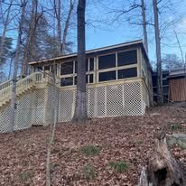 Full Deck Replacement & Screened-In Enclosure – Rough River, KY - Universal Interiors Remodel completed an impressive deck replacement and full enclosure project at a beautiful lakeside property on Rough River Lake. This multi-phase build transformed an outdated or worn deck into a spacious, weather-protected outdoor living area with stunning panoramic views of the water and surrounding wooded hills.
Key highlights from the project photos:
Exterior overview: A large elevated deck addition/replacement built on a sloped, wooded hillside, featuring sturdy pressure-treated wood framing, wide steps, lattice skirting for a clean under-deck appearance, and integrated railings with lattice panels for privacy and airflow. The structure seamlessly blends into the natural terrain, leading down toward the lake.
Staircase & landing views: Custom multi-level stair system with wide treads, solid handrails, and intermediate platforms/landings for safe, easy access to lower areas and the lakefront. Dark-stained railings and steps provide contrast and durability against the natural backdrop.
Interior screened enclosure: A massive, fully framed screened-in porch (roughly 20x30+ ft based on visuals) with vaulted ceiling framing, exposed engineered beams, and metal roofing overhead. Floor-to-ceiling screen panels offer unobstructed 360-degree views of the lake, trees, and sky while keeping bugs out. The interior features smooth pine or cedar flooring, ample headroom, and prepped space ready for furniture, lighting, or future finishes like ceiling fans.
Our team managed:
Complete removal of the old deck structure
Reinforced foundation and framing to handle hillside conditions and load requirements
Precise joist and beam installation for a level, bounce-free floor
Professional screening system with durable aluminum frames and tight mesh
High-quality stain/seal on all wood surfaces for protection against Kentucky's humidity, rain, and seasonal changes
The end result is a durable, low-maintenance screened deck paradise—perfect for year-round enjoyment, lake watching, entertaining, or relaxing with family. This project showcases our expertise in custom deck replacements, screened enclosures, hillside builds, and lakeside construction. Another happy Rough River homeowner with an elevated outdoor space built to last! #DeckReplacement #ScreenedInPorch #ScreenedDeck #RoughRiverKY #LakesideDeck #CustomDeckBuild #OutdoorLivingKY #HillsideDeck Full Deck Replacement & Screened-In Enclosure – Rough River, KY - Universal Interiors Remodel completed an impressive deck replacement and full enclosure project at a beautiful lakeside property on Rough River Lake. This multi-phase build transformed an outdated or worn deck into a spacious, weather-protected outdoor living area with stunning panoramic views of the water and surrounding wooded hills.
Key highlights from the project photos:
Exterior overview: A large elevated deck addition/replacement built on a sloped, wooded hillside, featuring sturdy pressure-treated wood framing, wide steps, lattice skirting for a clean under-deck appearance, and integrated railings with lattice panels for privacy and airflow. The structure seamlessly blends into the natural terrain, leading down toward the lake.
Staircase & landing views: Custom multi-level stair system with wide treads, solid handrails, and intermediate platforms/landings for safe, easy access to lower areas and the lakefront. Dark-stained railings and steps provide contrast and durability against the natural backdrop.
Interior screened enclosure: A massive, fully framed screened-in porch (roughly 20x30+ ft based on visuals) with vaulted ceiling framing, exposed engineered beams, and metal roofing overhead. Floor-to-ceiling screen panels offer unobstructed 360-degree views of the lake, trees, and sky while keeping bugs out. The interior features smooth pine or cedar flooring, ample headroom, and prepped space ready for furniture, lighting, or future finishes like ceiling fans.
Our team managed:
Complete removal of the old deck structure
Reinforced foundation and framing to handle hillside conditions and load requirements
Precise joist and beam installation for a level, bounce-free floor
Professional screening system with durable aluminum frames and tight mesh
High-quality stain/seal on all wood surfaces for protection against Kentucky's humidity, rain, and seasonal changes
The end result is a durable, low-maintenance screened deck paradise—perfect for year-round enjoyment, lake watching, entertaining, or relaxing with family. This project showcases our expertise in custom deck replacements, screened enclosures, hillside builds, and lakeside construction. Another happy Rough River homeowner with an elevated outdoor space built to last! #DeckReplacement #ScreenedInPorch #ScreenedDeck #RoughRiverKY #LakesideDeck #CustomDeckBuild #OutdoorLivingKY #HillsideDeck