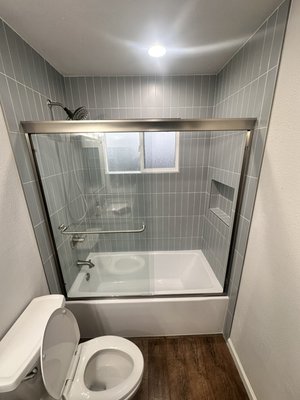 Bathroom Tub Upgrade - This custom bathtub remodel included complete demolition, waterproofing, new bathtub installation, custom tile surround, sliding glass shower doors, updated plumbing fixtures, and premium finish work. STL-HD Construction and Design specializes in bathroom remodeling, bathtub replacements, walk-in showers, custom tile installation, and full bathroom renovations.