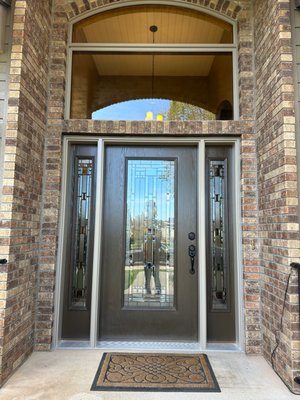 Front Door Replacement - This replacement was done due to the original double doors not sealing and allowing air and water infiltration. We changed the door configuration to a beautiful Bayer Built door with double sidelight that completely changed the curb appeal of the home and reduced energy costs by replacing the old leaky front door. Front Door Replacement - This replacement was done due to the original double doors not sealing and allowing air and water infiltration. We changed the door configuration to a beautiful Bayer Built door with double sidelight that completely changed the curb appeal of the home and reduced energy costs by replacing the old leaky front door.