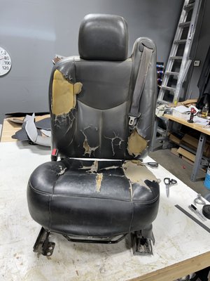 03 Silverado Truck Seat Repair - This seat came in with damaged upper and lower covers, ripped foam, cracked seat frame. We were able to re upholster and repair the seat same day for minimized down time. 03 Silverado Truck Seat Repair - This seat came in with damaged upper and lower covers, ripped foam, cracked seat frame. We were able to re upholster and repair the seat same day for minimized down time.