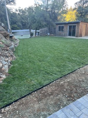 Grass Valley landscaping work - We added pavers and grass, we built stairs leading to the creek, fire pit a botchy ball and LED lights under the stairs was also added. This project was started from scratch and built everything new to the house and the landscape. Project came out really nice and another happy costumer.