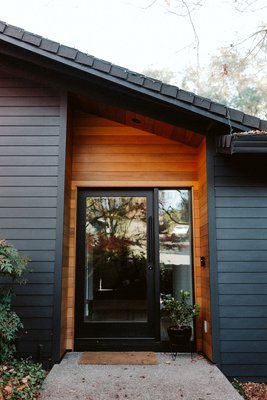 Siding & Windows - Our client recently purchased a neglected mid-century home. They wanted to replace the original single pane windows, inspect the framing and update the siding.
 
This project was particularly fun because we had to remove an entire wall of glass and replace it with built-on-site custom windows. We chose the tinted, Low-E, gas charged, dual pane Andersen windows with special black frames. When we removed the original windows and siding, we found dry-rot, termites, ants and old insulation. Our go-to pest control contractor took care of the bugs and we updated the insulation. Once the windows were up, we tackled the siding. The client chose top-of-the-line JM Hardie Plank with a unique 5" exposure.  
 
To give the house a more modern look, they opted for no window framing. They were thrilled with the result and needless to say we were happy to see our expertise put to beautiful use.