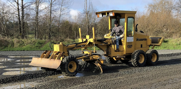 View our Gravel work - Before/After - Regular grading maintenance improves drainage and provides a smooth driving surface for your gravel road or parking lot.
We use a motor grader to spread gravel, base rock, or road base to create proper shaping and even distribution for the driving surface.
Proper driveway and parking area shaping removes potholes, ruts and washboards.
Proper shaping of the driving surface promotes drainage. Wheel compaction takes place throughout the shaping process.
Our pressurized water truck applies the proper amount of moisture for both cutting, shaping and compaction.
We use a vibratory steel roller during final grading and compaction. View our Gravel work - Before/After - Regular grading maintenance improves drainage and provides a smooth driving surface for your gravel road or parking lot.
We use a motor grader to spread gravel, base rock, or road base to create proper shaping and even distribution for the driving surface.
Proper driveway and parking area shaping removes potholes, ruts and washboards.
Proper shaping of the driving surface promotes drainage. Wheel compaction takes place throughout the shaping process.
Our pressurized water truck applies the proper amount of moisture for both cutting, shaping and compaction.
We use a vibratory steel roller during final grading and compaction.