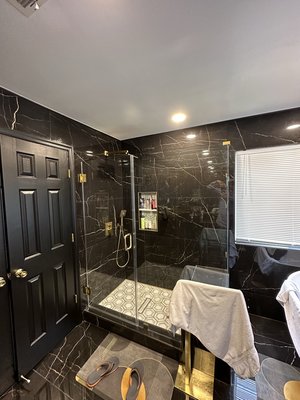 Bathroom Remodel - Black tiles with gold fixtures done in Columbia MD