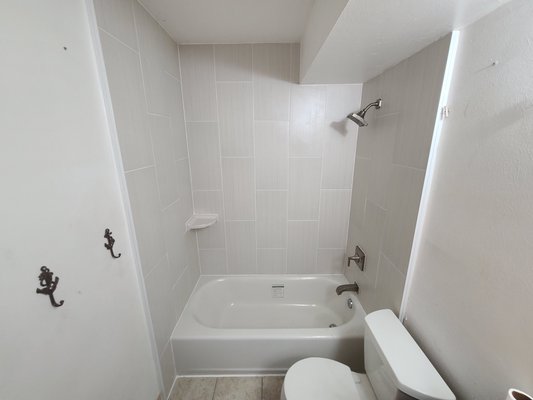 Remove and reinstall the tub/shower and surround. - This bathtub/shower remodel was done because the old tub was leaking into the Condominium unit below. Remove and reinstall the tub/shower and surround. - This bathtub/shower remodel was done because the old tub was leaking into the Condominium unit below.