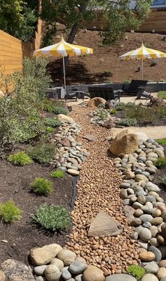 River design - This design was made on our client with our clients yard wish, however we added more design by adding mulch and different kind of plant that resists hot temperatures.