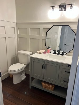 Half Bath Remodel - This half bath was remodeled with new flooring, vanity and fixtures, lighting, wainscoting, and paint. Half Bath Remodel - This half bath was remodeled with new flooring, vanity and fixtures, lighting, wainscoting, and paint.