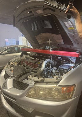 2003 Mitsubishi Lancer Evolution Clutch and Flywheel replacement - We replaced the clutch and flywheel on a 2003 Mitsubishi Lancer Evolution. The old parts were worn out and causing issues with the car's performance. By installing new components, we restored the vehicle's functionality, ensuring smoother gear shifts and reliable operation. This repair was necessary to bring the car back to its optimal driving condition. 2003 Mitsubishi Lancer Evolution Clutch and Flywheel replacement - We replaced the clutch and flywheel on a 2003 Mitsubishi Lancer Evolution. The old parts were worn out and causing issues with the car's performance. By installing new components, we restored the vehicle's functionality, ensuring smoother gear shifts and reliable operation. This repair was necessary to bring the car back to its optimal driving condition.