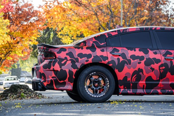 Printed Vehicle Wraps - This owner wanted a complete Bape wrap design, incorporating both the red Bape and Black Bape. The challenge and unique part of this design is we did the print in house, allowing us to have the design under one print, and not requiring a seam between the 2 colors. If you're seeking something creative, send us a message and we will take care of you! Printed Vehicle Wraps - This owner wanted a complete Bape wrap design, incorporating both the red Bape and Black Bape. The challenge and unique part of this design is we did the print in house, allowing us to have the design under one print, and not requiring a seam between the 2 colors. If you're seeking something creative, send us a message and we will take care of you!