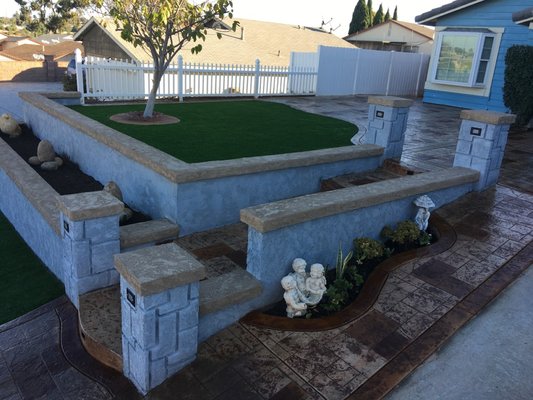 Front Yard Terrace - This home had a big slope out front, which we helped turn into terraces allowing for flat outdoor space for the family and two gardens.