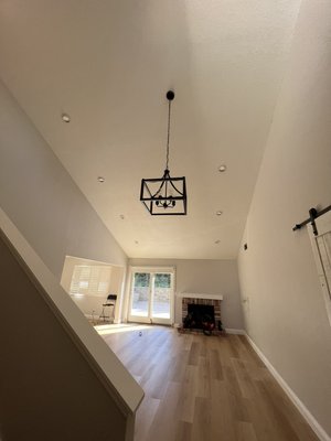 Recessed lights install in slanted ceiling 26ft high, chandelier install and kitchen recessed lights install - Added seven 6” recessed lights in living room with slanted ceiling. Demolition of fan/chandelier and installed new chandelier. Demolition of kitchen ceiling light and install five 4” recessed lights. Install in stair way one 6” recessed light.