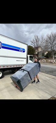 Heavy safe move - This is a 500lbs gun safe that has been wrapped up and strapped to a hand truck to ensure safe transportation.