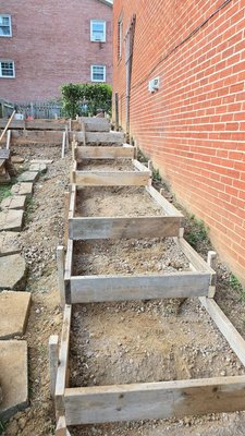 Steps Repair - We took this sloped area, which had a tree in the way, and transformed it completely. After removing the tree and clearing the space, we built a brand-new set of concrete stairs from the ground up. What was once an uneven and unused spot is now a functional and polished pathway, showcasing the perfect mix of durability and clean design.