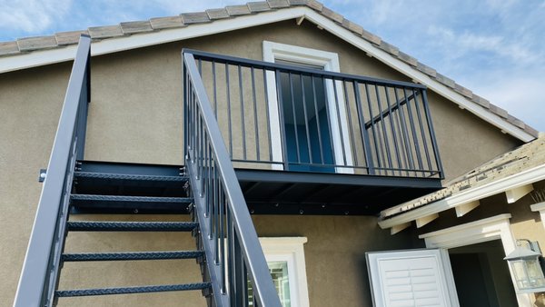 Oceanside guard rail with access ladder - Custom-crafted all-steel guardrail and access ladder: a seamless blend of form and function, providing safe access to breathtaking ocean views.