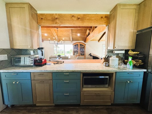 Kitchen Wall Opening - This client wanted to open her kitchen wall to have an open space to view through her living room and install a bar top on other side. Kitchen Wall Opening - This client wanted to open her kitchen wall to have an open space to view through her living room and install a bar top on other side.