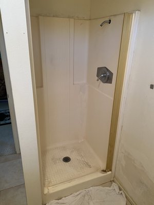 Fiberglass shower refinishing - This bathroom was getting new paint, cabinets, and toilet. The refinish started the project - high gloss pure white with a five year warranty! Fiberglass shower refinishing - This bathroom was getting new paint, cabinets, and toilet. The refinish started the project - high gloss pure white with a five year warranty!