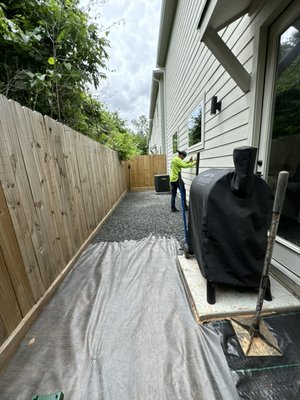 Black star gravel surface. - Customer has a very small backyard & wanted a cost effective way of making the yard more useful & not breaking the bank we designed a simple gravel hard surface!