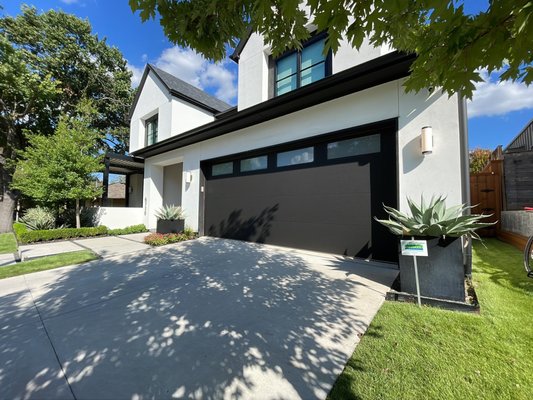 Out with the Glass Door - While glass doors are always a great add-on to any home, sometimes being energy efficient and having a high U-value is important to moderate the inside temperature. We turned to Clopay's Lustra in Black to provide an unmatched finish. Another perfect door for the home!