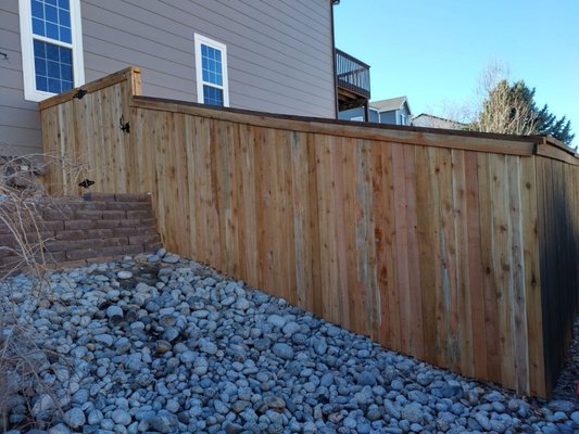 NEWLY BUILT WING FENCE AND ACCESS GATE - This beautiful wing with side access gate was installed on a home in Highlands Ranch on December 4. Both height and top runner were completed under HOA specifications.