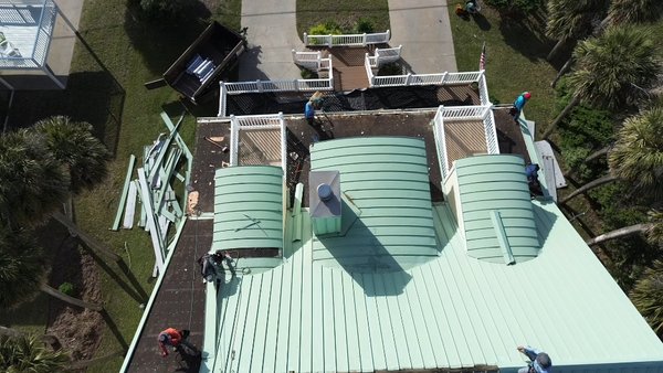Aluminum standing seam roof at Edisto Beach - 🚀 Transformative Aluminum Standing Seam Roof Project Underway! 🚀

Take a look at our latest roof coating project in action! Our dedicated team is expertly applying a premium protective coating to this striking roof. The coating process is designed to enhance durability, improve energy efficiency, and extend the roof's lifespan.

The transformation features meticulous application techniques to ensure a seamless and durable finish, safeguarding the roof against weather elements while adding a fresh, new look.