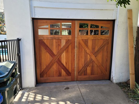 Beautiful custom stain grade mahogany wood garage door with side mount opener - This beautiful custom wood door is made from mahogany for durability and beautiful stain lines as seen in the pictures.
We can create almost any door or window design.
In addition, we installed the 8500 side mount opener by Lift Master, to save space and create a clean look. Beautiful custom stain grade mahogany wood garage door with side mount opener - This beautiful custom wood door is made from mahogany for durability and beautiful stain lines as seen in the pictures.
We can create almost any door or window design.
In addition, we installed the 8500 side mount opener by Lift Master, to save space and create a clean look.