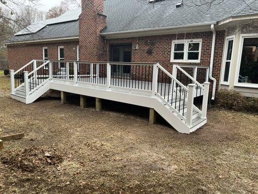 Deck Rebuild - These clients wanted to rebuild their worn out deck, but also wanted to add some space for entertaining and a “gardening” hobby. We extended the deck outward four additional feet. This deck is made up of all Trex decking materials and various framing materials like Simpson Strong Tie and Fastenmaster. The client selected Pebble Gray flooring and drink rail, and white/black railing. We finished it off with Trex fascia board all around!