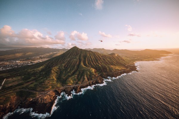 Oahu 60 Minute VIP Experience - $380 Per Person - Direct Only - Experience one of the ultimate helicopter tours on Oahu in VIP luxury. Fly with the doors off (or on) around Oahu just like the TV show Magnum P.I.! Depart Honolulu airport and begin your helicopter adventure by flying over Waikiki’s shoreline, where the modern metropolis of Honolulu meets the white sands of Waikiki’s iconic beaches.
Your tour continues down the leeward coast to Diamond Head, Koko Head, and the historic Makapuu Point Lighthouse. Continuing north up the windward coast, you pass over Kailua Beach, the famous landmark Chinaman’s Hat, and the pristine waters of Kaneohe Bay.
The tour continues north to Kaaawa (Jurassic) Valley and Sacred Falls, followed by breathtaking views of Oahu’s famous North Shore. The views of Banzai Pipeline and Waimea Bay, home of Oahuu’s legendary monster waves, are spectacular. Your tour closes with a slow flyover of Pearl Harbor and the USS Arizona. Experience the ultimate Oahu helicopter tour! Oahu 60 Minute VIP Experience - $380 Per Person - Direct Only - Experience one of the ultimate helicopter tours on Oahu in VIP luxury. Fly with the doors off (or on) around Oahu just like the TV show Magnum P.I.! Depart Honolulu airport and begin your helicopter adventure by flying over Waikiki’s shoreline, where the modern metropolis of Honolulu meets the white sands of Waikiki’s iconic beaches.
Your tour continues down the leeward coast to Diamond Head, Koko Head, and the historic Makapuu Point Lighthouse. Continuing north up the windward coast, you pass over Kailua Beach, the famous landmark Chinaman’s Hat, and the pristine waters of Kaneohe Bay.
The tour continues north to Kaaawa (Jurassic) Valley and Sacred Falls, followed by breathtaking views of Oahu’s famous North Shore. The views of Banzai Pipeline and Waimea Bay, home of Oahuu’s legendary monster waves, are spectacular. Your tour closes with a slow flyover of Pearl Harbor and the USS Arizona. Experience the ultimate Oahu helicopter tour!